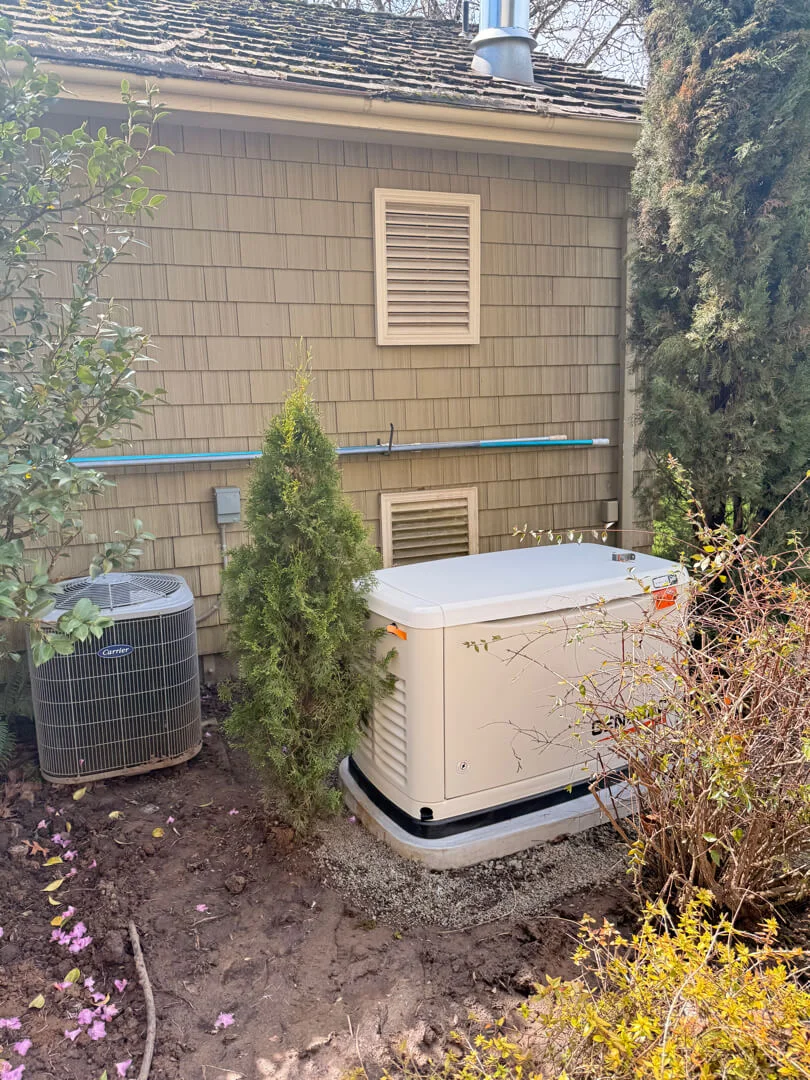 Standby generator installed beside a home