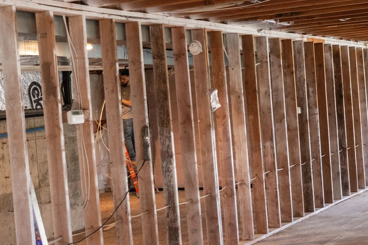 Smiley Electric electrician wiring a Portland home mid-remodel