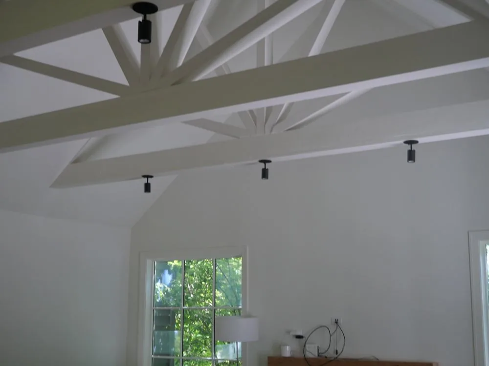 Finished vaulted great room with recessed lighting installed by Smiley Electric